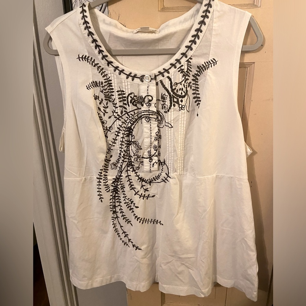 White tank with brown design